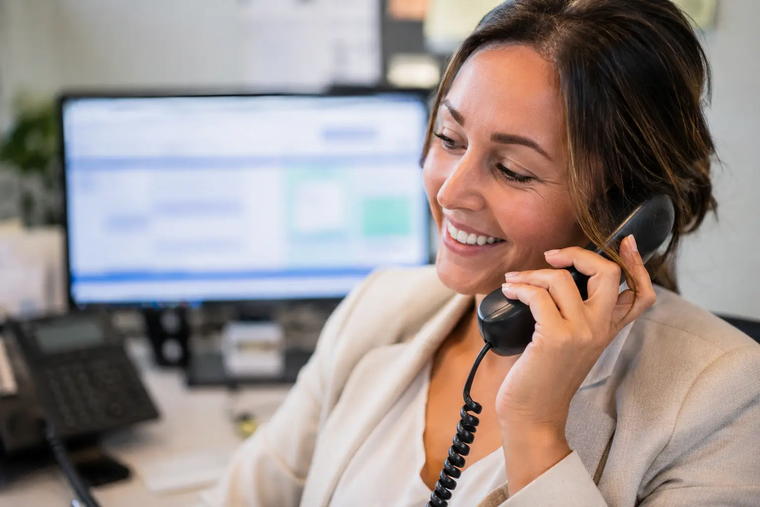 A discharge planner on the phone confirming home care arrangements
